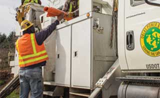 photo of OPALCO crew members on truck