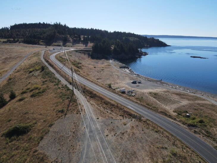 aerial view of the newly relocated power poles on Jackson Beach on San Juan Island.