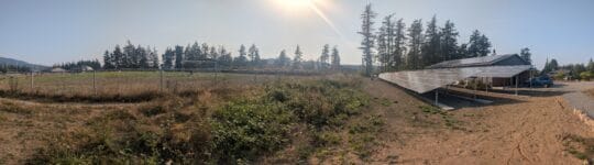 A panoraic view of the new Orcas Center solar array on the dance studio and behind the building. 