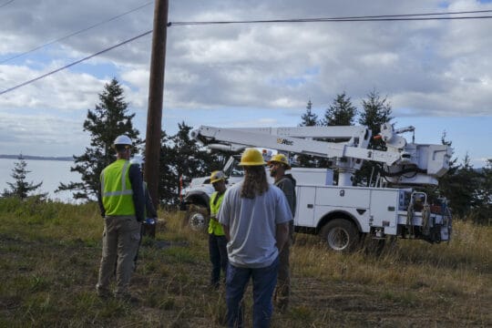 OPALCO crew holding a tailgater safety meeting on site before a job.