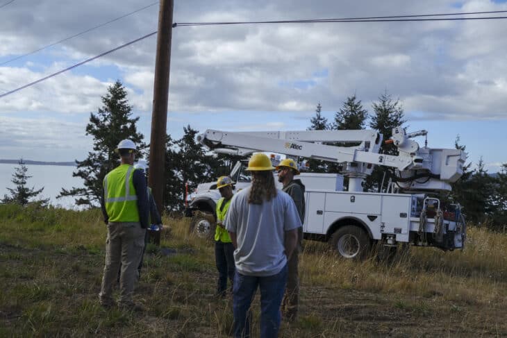 OPALCO crew holding a tailgater safety meeting on site before a job.